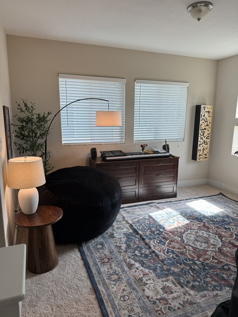 Warm natural-light view of the comfortable private music teaching loft