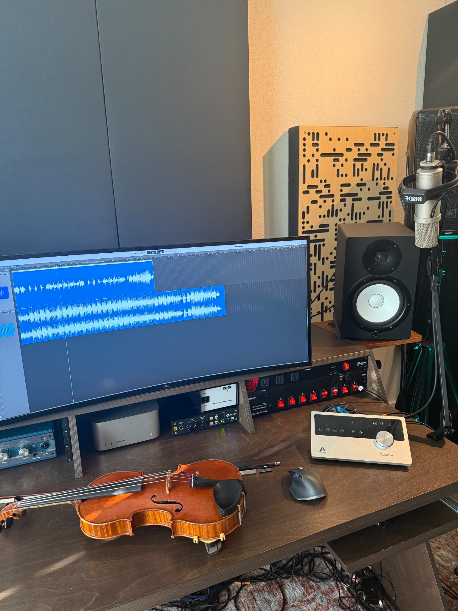French violin, microphone, Apogee interface, studio monitor, and active Logic recording session in David Price's Austin studio