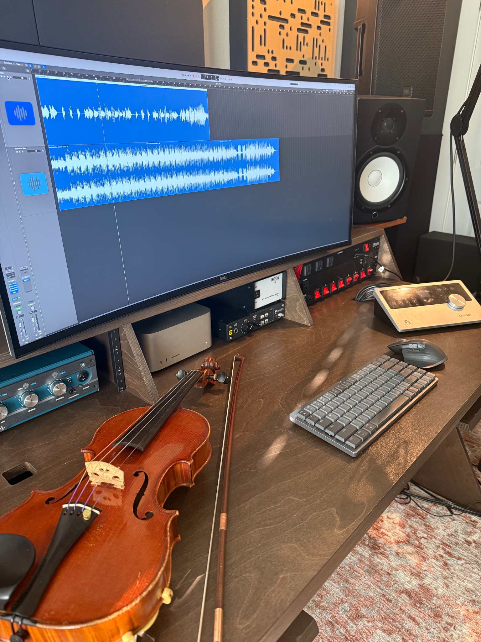 Violin beside an active Logic session at David Price's recording workstation