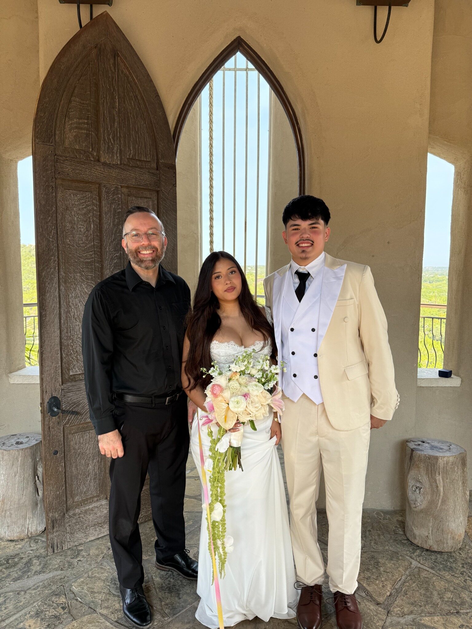 David Price with a newly married couple after their wedding ceremony